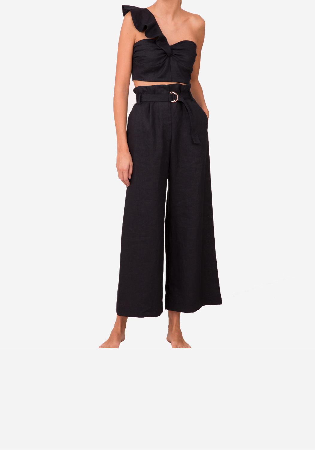 Model wearing one-shoulder linen crop top with ruffle detail and bustier front — sustainable resortwear from 6ShoreRoad