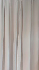 Model wearing Montauk Bikini Top with front tie and removable cups, made in Italian fabric for poolside and beach bar wear